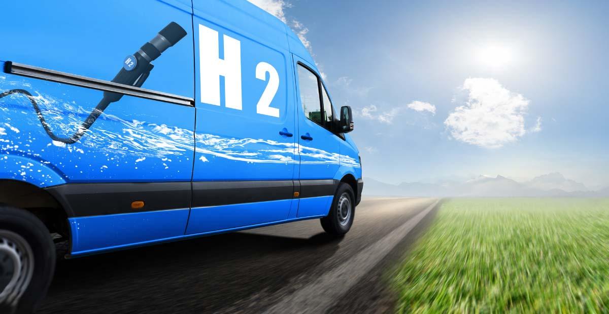 Blue van with an 'H2' hydrogen pump logo